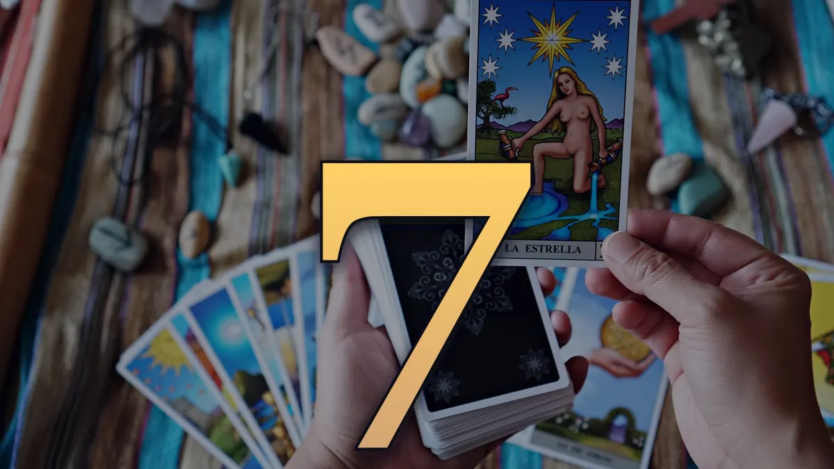 Tarot card reading session showing 'The Star' card held over a vibrant cloth.